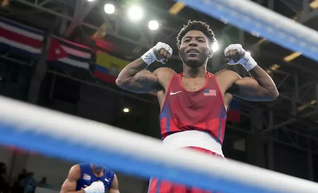 FILE - Jahmal Harvey of the United States celebrates defeating Cuba's Saidel Horta in a men's boxing 57kg final bout at the Pan American Games in Santiago, Chile, Friday, Oct. 27, 2023. (AP Photo/Martin Mejia, File)