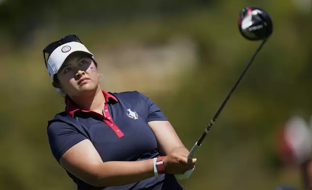FILE - United States' Lilia Vu plays her tee shot on the 4th hole during her single match at the Solheim Cup golf tournament in Finca Cortesin, near Casares, southern Spain, Sunday, Sept. 24, 2023. Europe play the United States in this biannual women's golf tournament, which played alternately in Europe and the United States. (AP Photo/Bernat Armangue, File)