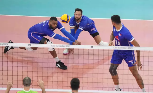 FILE - France's Earvin N'Gapeth, left, in action during the Men's European Volleyball bronze medal final between France and Slovenia, in Rome, Saturday, Sept. 16, 2023. (AP Photo/Andrew Medichini, File)