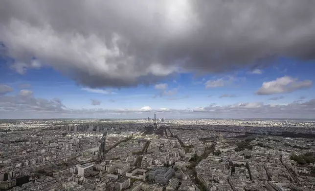 Paris city, with the Eiffel Tower at center, are pictured Monday, April 15, 2024 in Paris. (AP Photo/Aurelien Morissard)