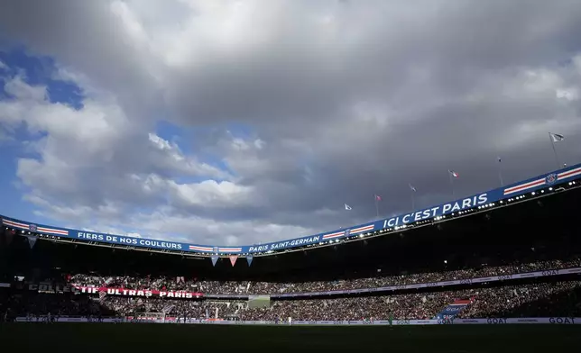 Clouds gather above the stadium during the French League One soccer match between Paris Saint-Germain and Rennes at the Parc des Princes in Paris, Sunday, March 19, 2023. The Parc des Princes will host the Paris 2024 men and women's soccer competitions (AP Photo/Christophe Ena, File)