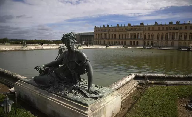 The statue « Nymphe et enfant au trident » by Philippe Magnier is seen in the gardens of the Chateau de Versailles, outside Paris, France, Tuesday, Sept.19, 2023. The park of the Chateau de Versailles will host the equestrian events at the Paris 2024 Olympic Games. (AP Photo/Christophe Ena, File)