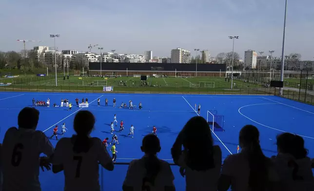 Youths play field hockey, at the renovated Yves-du-Manoir stadium in Colombes, outside Paris, Thursday, March 21, 2024. The stadium will host the men's and women's field hockey competitions during the Pairs 2024 Olympic Games (AP Photo/Thibault Camus, File)
