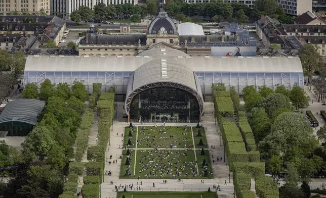 The Grand Palais Ephemere is seen, Sunday, April 14, 2024 in Paris. The Grand Palais Ephemere, or Champ de Mars Arena, will host Judo and Wrestling competitions at the Paris 2024 Olympic Games. (AP Photo/Aurelien Morissard, File)