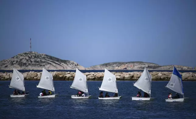 School children sail during a demonstration at the Roucas Blanc Marina constructed for the upcoming summer Olympic Games in Marseille, southern France, Tuesday, April 2, 2024. Marseille will host the Olympic sailing events during the Paris 2024 Olympic Games that run from July 26 to Aug.11, 2024. (AP Photo/Daniel Cole, File)