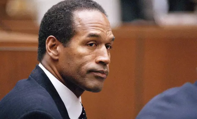 FILE - O.J. Simpson sits at his arraignment in Superior Court in Los Angeles on July 22, 1994, where he pleaded "absolutely, 100 percent not guilty" on murder charges. Simpson, the decorated football superstar and Hollywood actor who was acquitted of charges he killed his former wife and her friend but later found liable in a separate civil trial, died Wednesday, April 11, 2024, of prostate cancer. He was 76. (AP Photo/Pool/Lois Bernstein, Pool)