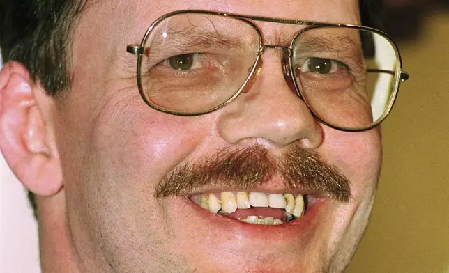 FILE - Former hostage Terry Anderson, the Associated Press chief Middle East correspondent, smiles during a news conference despite his broken glasses, Dec. 6, 1991, in Damascus, Syria. Anderson, the globe-trotting Associated Press correspondent who became one of America’s longest-held hostages after he was snatched from a street in war-torn Lebanon in 1985 and held for nearly seven years, died Sunday, April 21, 2024, at age 76. (AP Photo/Santiago Lyon, File)