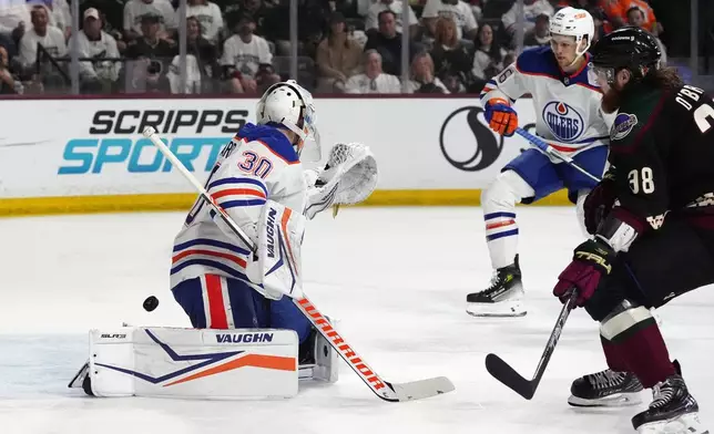 Arizona Coyotes center Liam O'Brien (38) scores a goal against Edmonton Oilers goaltender Calvin Pickard (30) as Oilers defenseman Philip Broberg, right rear, watches during the first period of an NHL hockey game Wednesday, April 17, 2024, in Tempe, Ariz. (AP Photo/Ross D. Franklin)