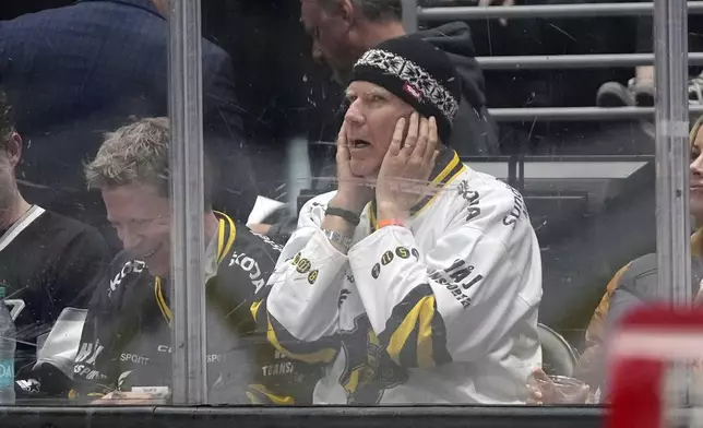 Actor Will Ferrell covers his ears as the crowd is asked to make noise during the first period in Game 4 of an NHL hockey Stanley Cup first-round playoff series between the Los Angeles Kings and the Edmonton Oilers Sunday, April 28, 2024, in Los Angeles. (AP Photo/Mark J. Terrill)