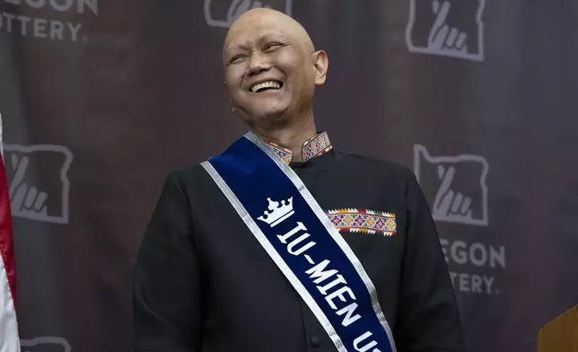 Cheng "Charlie" Saephan laughs while speaking during a press conference after it was revealed that he was one of the winners of the $1.3 billion Powerball jackpot at the Oregon Lottery headquarters on Monday, April 29, 2024, in Salem, Ore. (AP Photo/Jenny Kane)