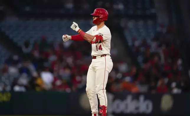 Los Angeles Angels' Logan O'Hoppe gestures after hitting a double to score Taylor Ward during the third inning of a baseball game against the Baltimore Orioles, Tuesday, April 23, 2024, in Anaheim, Calif. (AP Photo/Ryan Sun)