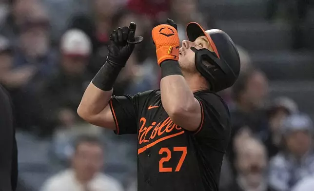 Baltimore Orioles' James McCann gestures as he scores after hitting a solo home run during the second inning of a baseball game against the Los Angeles Angels Monday, April 22, 2024, in Anaheim, Calif. (AP Photo/Mark J. Terrill)