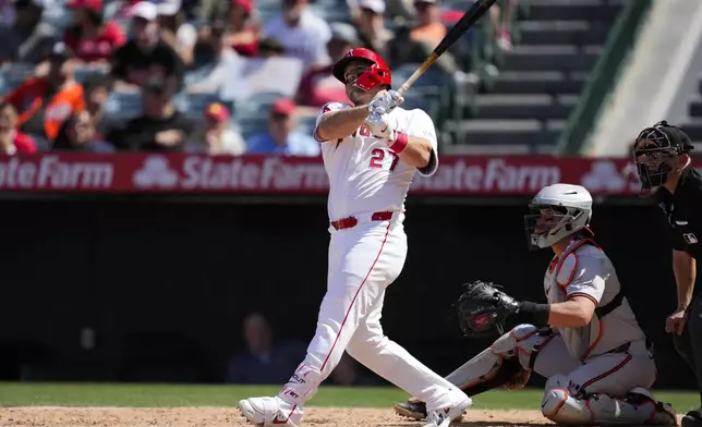 Los Angeles Angels designated hitter Mike Trout hits a home run during the sixth inning of a baseball game against the Baltimore Orioles in Anaheim, Calif., Wednesday, April 24, 2024. (AP Photo/Ashley Landis)