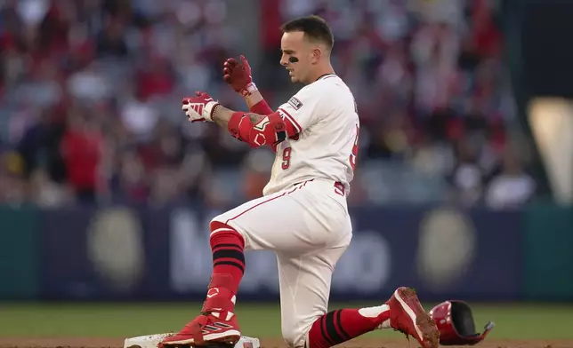 Los Angeles Angels' Zach Neto gestures after hitting a double to score Luis Rengifo during the second inning of a baseball game against the Baltimore Orioles, Tuesday, April 23, 2024, in Anaheim, Calif. (AP Photo/Ryan Sun)