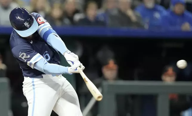 Kansas City Royals' Hunter Renfroe hits a two-run double during the sixth inning of a baseball game against the Baltimore Orioles Friday, April 19, 2024, in Kansas City, Mo. (AP Photo/Charlie Riedel)