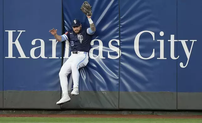 Kansas City Royals center fielder Kyle Isbel catches a fly ball for the out on Baltimore Orioles' Ryan O'Hearn during the fourth inning of a baseball game Friday, April 19, 2024, in Kansas City, Mo. (AP Photo/Charlie Riedel)