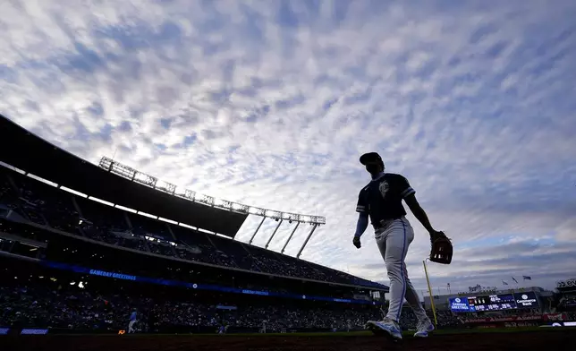 Kansas City Royals left fielder MJ Melendez walks to thee dugout during the third inning of a baseball game against the Baltimore Orioles Friday, April 19, 2024, in Kansas City, Mo. (AP Photo/Charlie Riedel)
