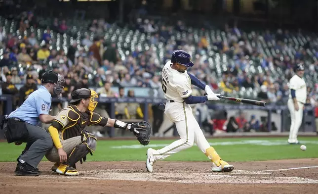 Milwaukee Brewers' Blake Perkins gets an RBI hit during the eighth inning of a baseball game against the San Diego Padres Wednesday, April 17, 2024, in Milwaukee. (AP Photo/Morry Gash)