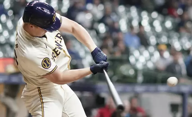 Milwaukee Brewers' Joey Wiemer hits a single during the seventh inning of a baseball game against the San Diego Padres Tuesday, April 16, 2024, in Milwaukee. (AP Photo/Morry Gash)