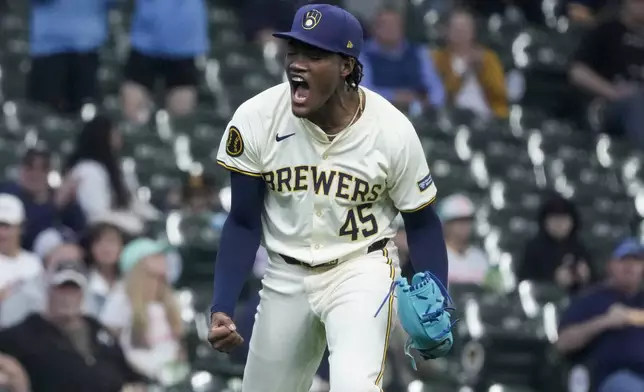 Milwaukee Brewers pitcher Abner Uribe reacts after getting San Diego Padres' Fernando Tatis Jr. out during the eighth inning of a baseball game Wednesday, April 17, 2024, in Milwaukee. (AP Photo/Morry Gash)