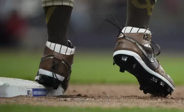 San Diego Padres' Fernando Tatis Jr. wears cleats for Jackie Robinson Day during the sixth inning of a baseball game against the Milwaukee Brewers Monday, April 15, 2024, in Milwaukee. (AP Photo/Morry Gash)