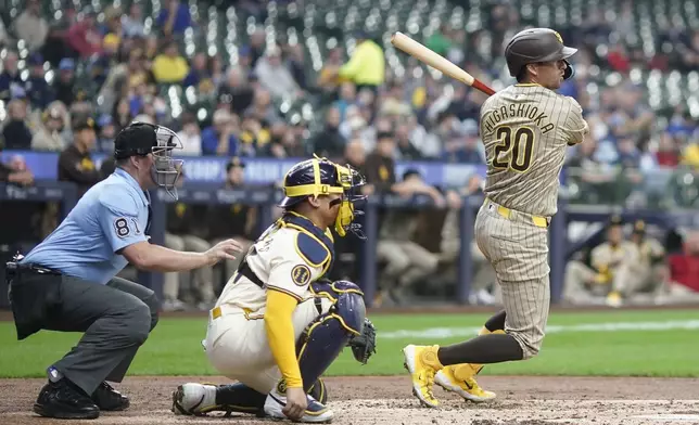 San Diego Padres' Kyle Higashioka hits a double during the third inning of a baseball game against the Milwaukee Brewers Wednesday, April 17, 2024, in Milwaukee. (AP Photo/Morry Gash)