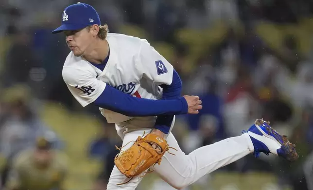 Los Angeles Dodgers starting pitcher Gavin Stone follows through on a throw to a San Diego Padres batter during the first inning of a baseball game Saturday, April 13, 2024, in Los Angeles. (AP Photo/Marcio Jose Sanchez)