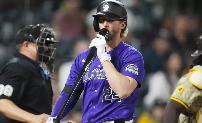 Colorado Rockies' Ryan McMahon (24) reacts after striking out against San Diego Padres relief pitcher Dylan Cease in the seventh inning of a baseball game Monday, April 22, 2024, in Denver. (AP Photo/David Zalubowski)