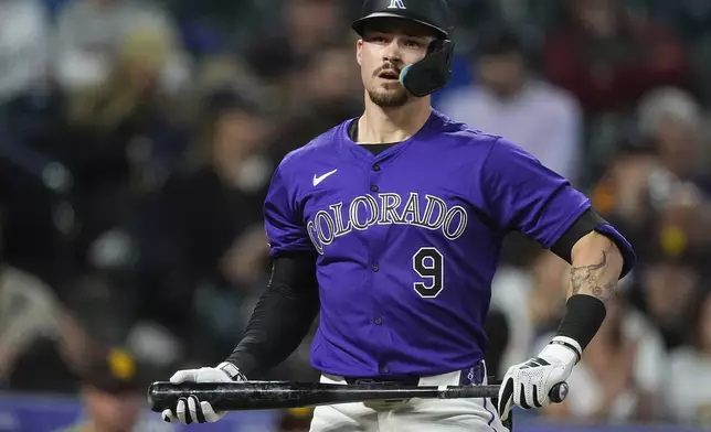 Colorado Rockies' Brenton Doyle reacts after striking out against San Diego Padres relief pitcher Dylan Cease to end the fifth inning of a baseball game Monday, April 22, 2024, in Denver. (AP Photo/David Zalubowski)