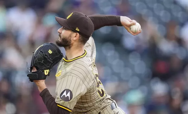 San Diego Padres starting pitcher Dylan Cease works against the Colorado Rockies in the second inning of a baseball game Monday, April 22, 2024, in Denver. (AP Photo/David Zalubowski)