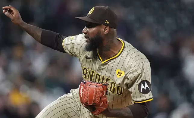 San Diego Padres relief pitcher Enyel De Los Santos works against the Colorado Rockies in the eighth inning of a baseball game Monday, April 22, 2024, in Denver. (AP Photo/David Zalubowski)