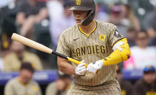 San Diego Padres' Ha-Seong Kim is called out on strikes while facing Colorado Rockies relief pitcher Nick Mears in the seventh inning of a baseball game Thursday, April 25, 2024, in Denver. (AP Photo/David Zalubowski)