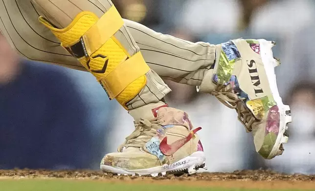 FILE - San Diego Padres' Fernando Tatis Jr.'s cleats are seen as Tatis grounds out during the 10th inning of a baseball game against the Los Angeles Dodgers on April 12, 2024, in Los Angeles. Tatis Jr. plans to unveil 50 pairs of custom cleats this season.(AP Photo/Mark J. Terrill, File)