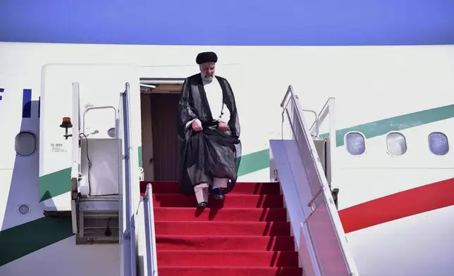In this photo released by Pakistan's Ministry of Foreign Affairs, Iranian President Ebrahim Raisi gets down from plane upon his arrival in Islamabad, Pakistan, Monday, April 22, 2024. Raisi arrived in Islamabad on a three-day visit on Monday, during which he will discuss a range of issues with authorities in Pakistan's capital, officials said. (Ministry of Foreign Affairs via AP)