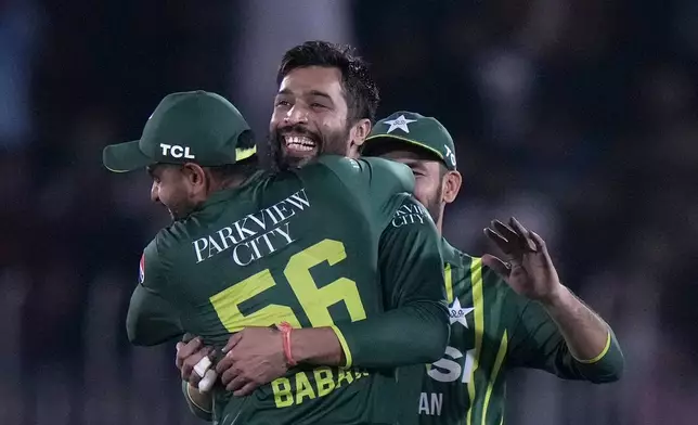 Pakistan's Mohammad Amir, center, celebrates with teammates after taking the wicket of New Zealand's Tim Robinson during the second T20 international cricket match between Pakistan and New Zealand, in Rawalpindi, Pakistan, Saturday, April 20, 2024. (AP Photo/Anjum Naveed)