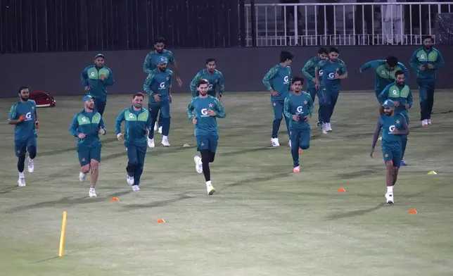 Pakistan's cricket players warm up for a practice session in Rawalpindi, Pakistan, Tuesday, April 16, 2024. (AP Photo/Anjum Naveed)
