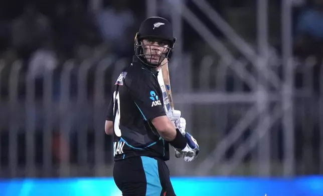 New Zealand's Michael Bracewell walks off the field after losing his wicket during the second T20 international cricket match between Pakistan and New Zealand, in Rawalpindi, Pakistan, Saturday, April 20, 2024. (AP Photo/Anjum Naveed)
