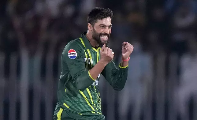 Pakistan's Mohammad Amir celebrates after taking the wicket of New Zealand's Dean Foxcroft during the second T20 international cricket match between Pakistan and New Zealand, in Rawalpindi, Pakistan, Saturday, April 20, 2024. (AP Photo/Anjum Naveed)