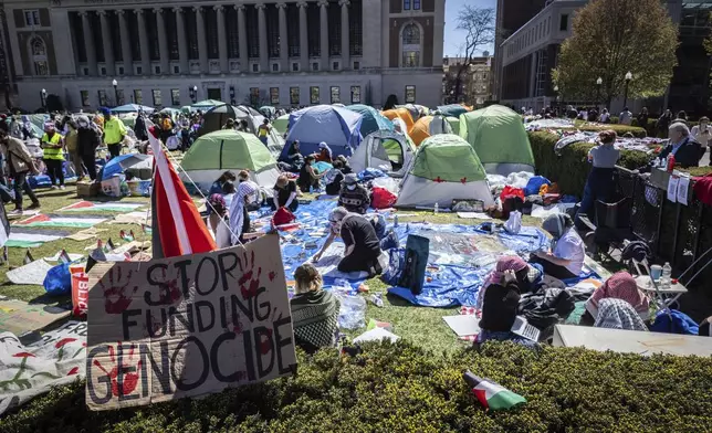 A sign sits erected at the Pro-Palestine protest encampment at the Columbia University campus in New York on Monday April 22, 2024. (AP Photo/Stefan Jeremiah) (AP Photo/Stefan Jeremiah)