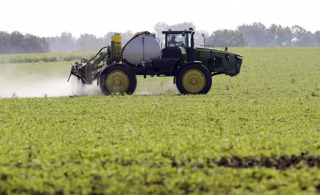 FILE - A soybean field is sprayed in Iowa, July 11, 2013. The maker of a popular weedkiller is turning to lawmakers in key states to try to squelch legal claims that it failed to warn about cancer risks. (AP Photo/Charlie Neibergall, File)