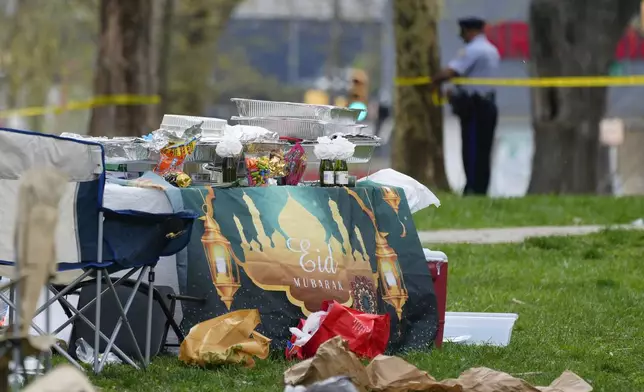 Shown are personal items left behind at the scene of a shooting at an Eid al-Fitr event in Philadelphia, Wednesday, April 10, 2024. (AP Photo/Matt Rourke)