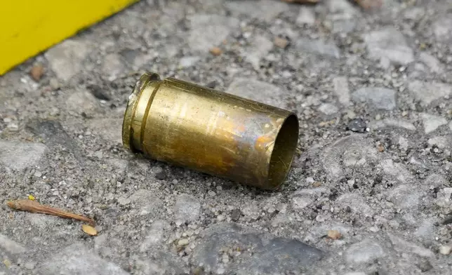 A cartridge case lies at the scene of a shooting at an Eid event in Philadelphia, Wednesday, April 10, 2024. (AP Photo/Matt Rourke)