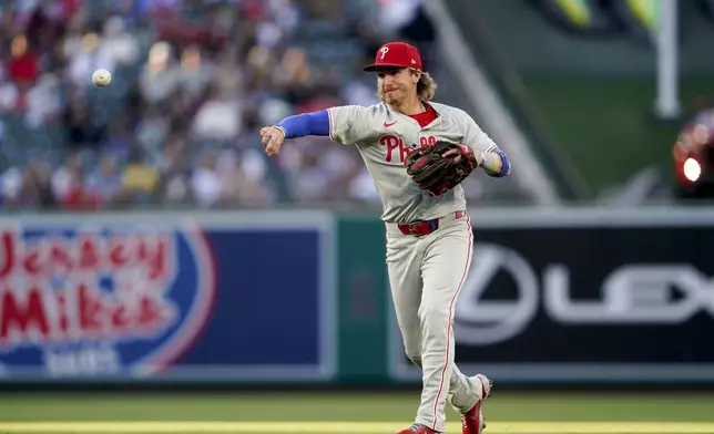 Philadelphia Phillies second baseman Bryson Stott throws out Los Angeles Angels' Taylor Ward at first during the first inning of a baseball game, Monday, April 29, 2024, in Anaheim, Calif. (AP Photo/Ryan Sun)