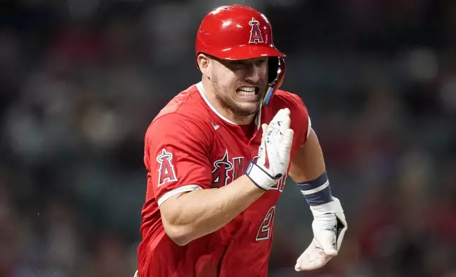 Los Angeles Angels' Mike Trout runs after a single during the seventh inning of a baseball game against the Philadelphia Phillies, Monday, April 29, 2024, in Anaheim, Calif. (AP Photo/Ryan Sun)
