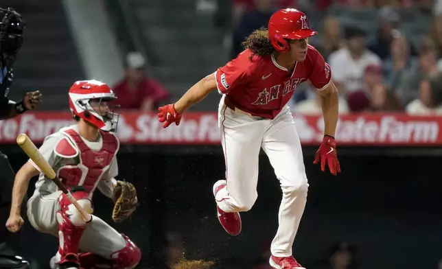Los Angeles Angels designated hitter Cole Tucker hits a single to score Brandon Drury during the sixth inning of a baseball game against the Philadelphia Phillies, Monday, April 29, 2024, in Anaheim, Calif. (AP Photo/Ryan Sun)