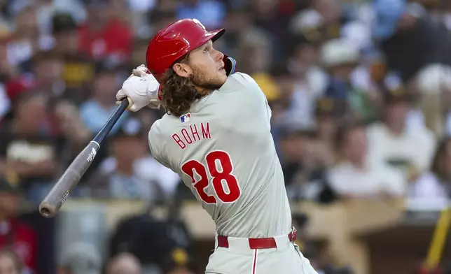 Philadelphia Phillies' Alec Bohm flies out during the fourth inning of the team's baseball game against the San Diego Padres, Saturday, April 27, 2024, in San Diego. (AP Photo/Brandon Sloter)