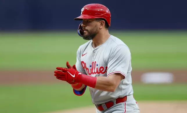 Philadelphia Phillies' Kyle Schwarber celebrates after his solo home run during the first inning of a baseball game against the San Diego Padres, Friday, April 26, 2024, in San Diego. (AP Photo/Brandon Sloter)