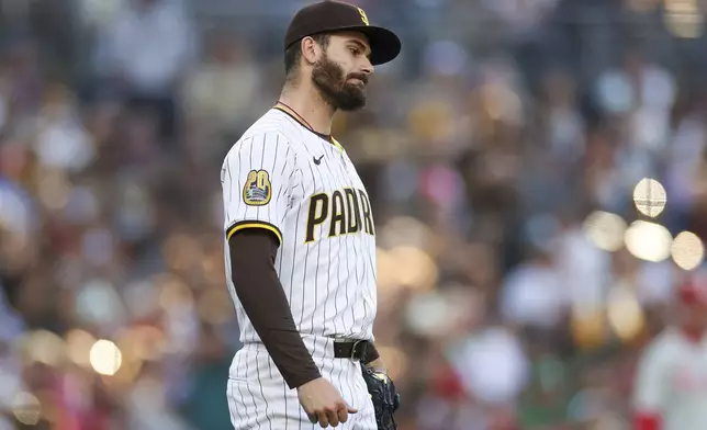 San Diego Padres starting pitcher Dylan Cease reacts during the fourth inning of the team's baseball game against the Philadelphia Phillies, Saturday, April 27, 2024, in San Diego. (AP Photo/Brandon Sloter)