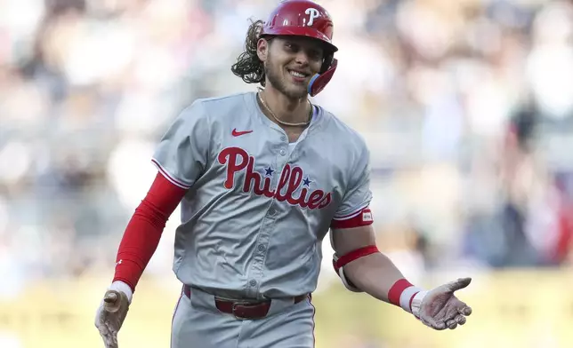 Philadelphia Phillies' Alec Bohm smiles after hitting a two-run home run against the San Diego Padres during the first inning of a baseball game Saturday, April 27, 2024, in San Diego. (AP Photo/Brandon Sloter)