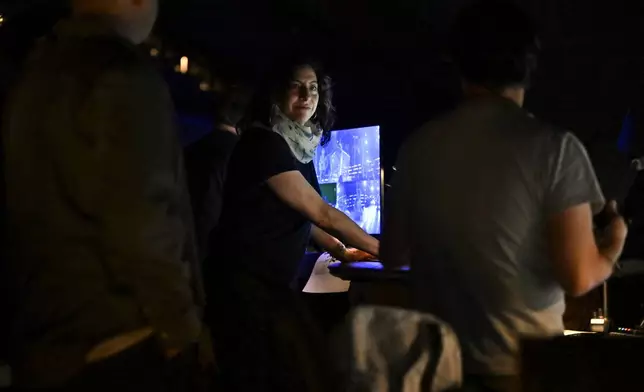 Abigail Rosen Holmes, show director and co-creative director for the band Phish's upcoming show at the Sphere, works in the control booth during rehearsals on Tuesday, April 16, 2024, in Las Vegas. (AP Photo/David Becker)